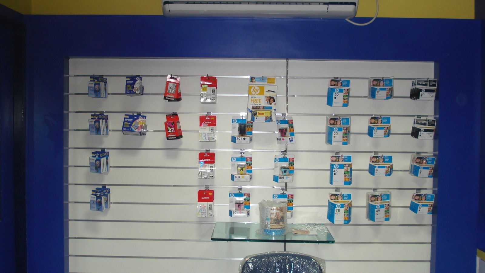 Slat-wall product display with printer cartridges inside the retail store