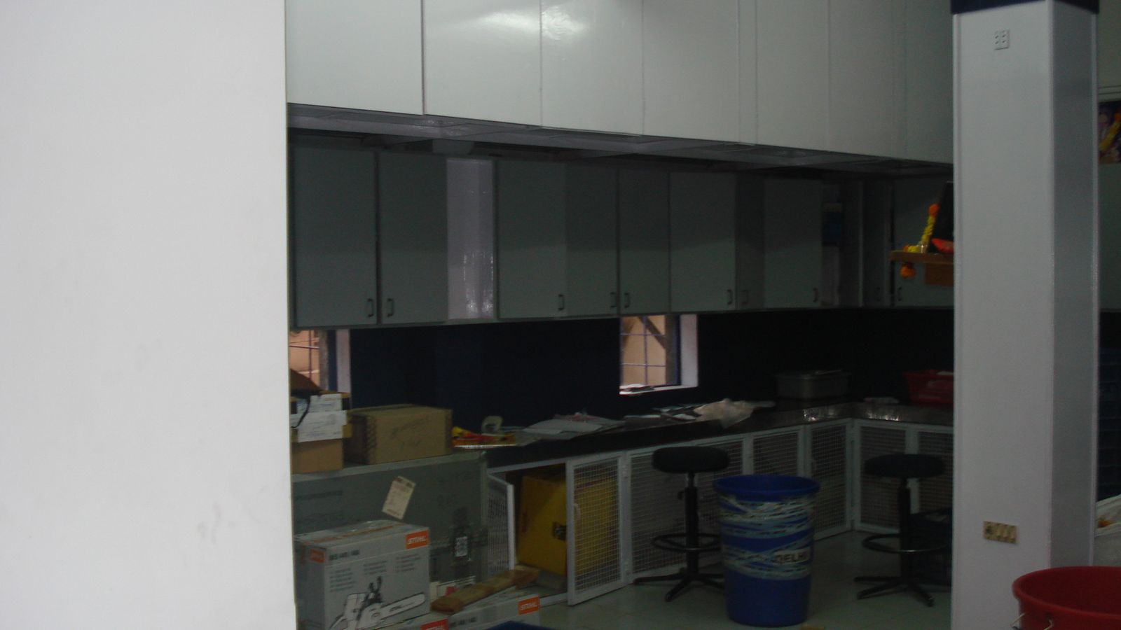 Finished office pantry with wall and base storage cabinets in Pune